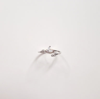 front view of silver butterfly ring on white background