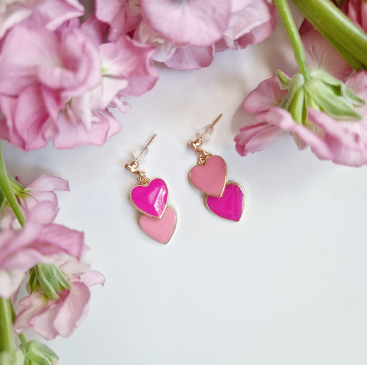 gold drop earrings with pink heart pendants
