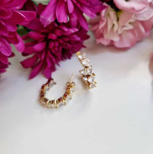 Gold hoop earrings with heart shaped zircon stones