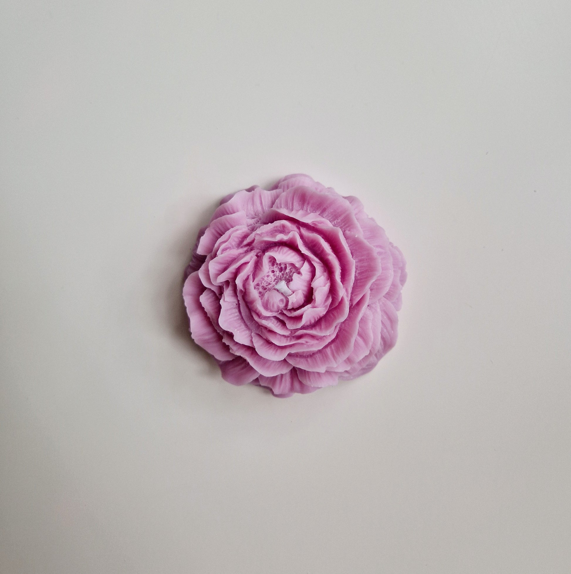 top view of pink peony candle