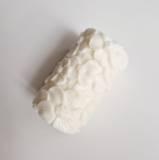 white floral pillar candle