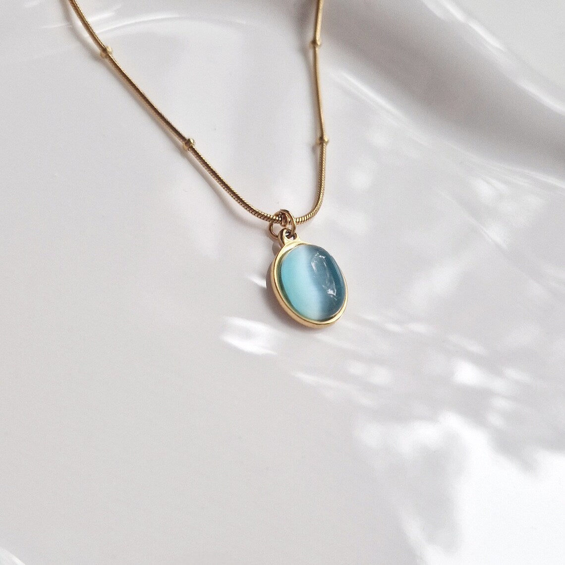 close up of aquamarine pendant necklace
